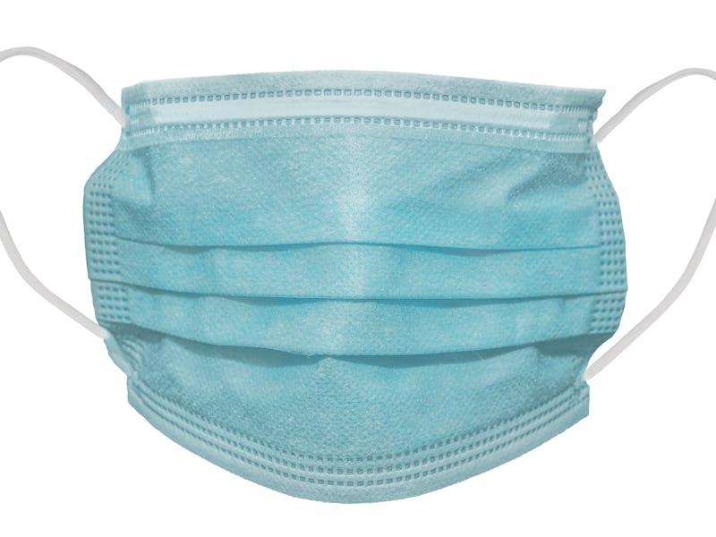 Surgical or medical mask with rubber ear straps. Typical 3-ply doctor mask to cover the mouth and no...