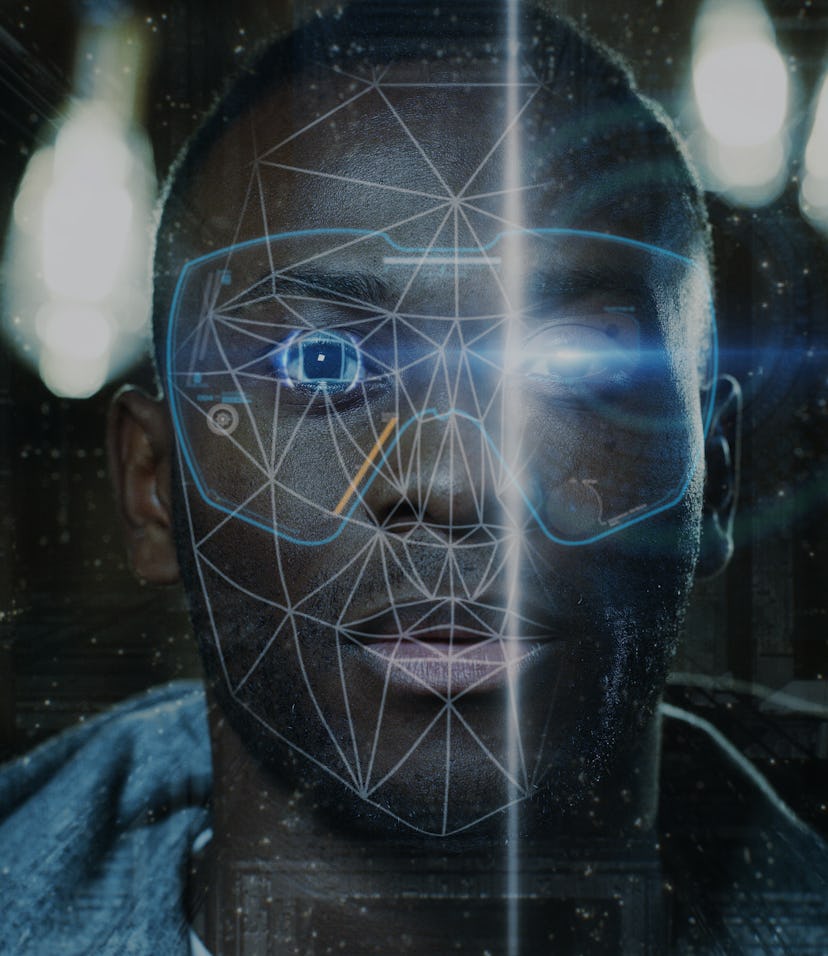 Futuristic and technological scanning of the face of a young african man for facial recognition and ...