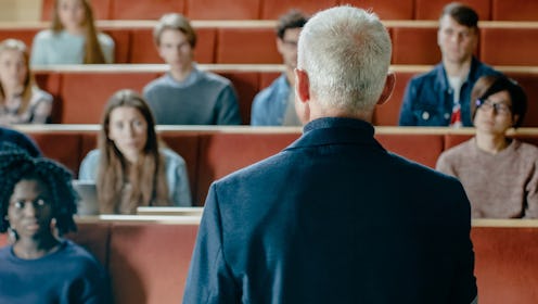 Camera Facing Class: College Professor Gives a Lecture to a Classroom Full of Multi Ethnic Students....