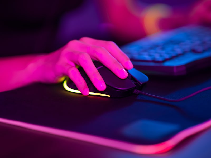 close up of cyber sport gamer play game and click the mouse