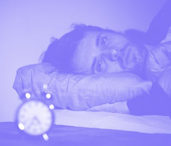 Sleepless and desperate young caucasian man awake at night not able to sleep, feeling frustrated and...