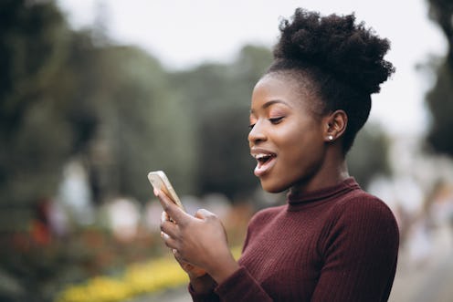 A woman is texting her crush and looking surprised. Valentine's Day 2022 and the Full Snow Moon will...