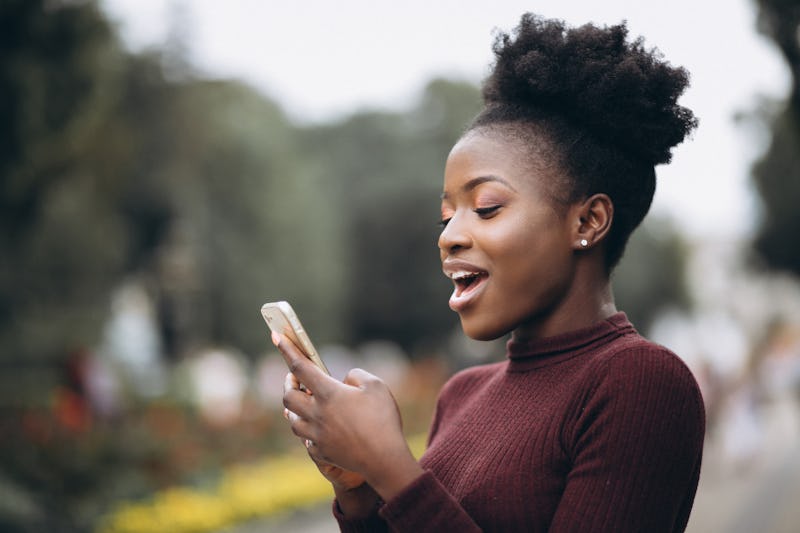 A woman is texting her crush and looking surprised. Valentine's Day 2022 and the Full Snow Moon will...