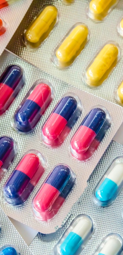 pharmaceuticals antibiotics pills medicine /colorful antibacterials pills on  white background /caps...