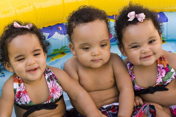 Siblings having fun outside (multiples)