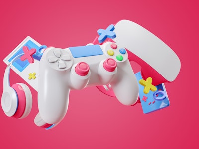 Colorful gamepad, headphones and game console hanging isolated on a pink background. Gaming concept....