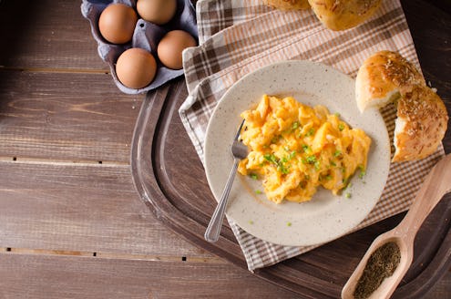 Scrambled eggs with buns, herbs inside, fast and delicious breakfast