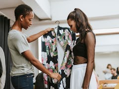 Stylist choosing an outfit for the model