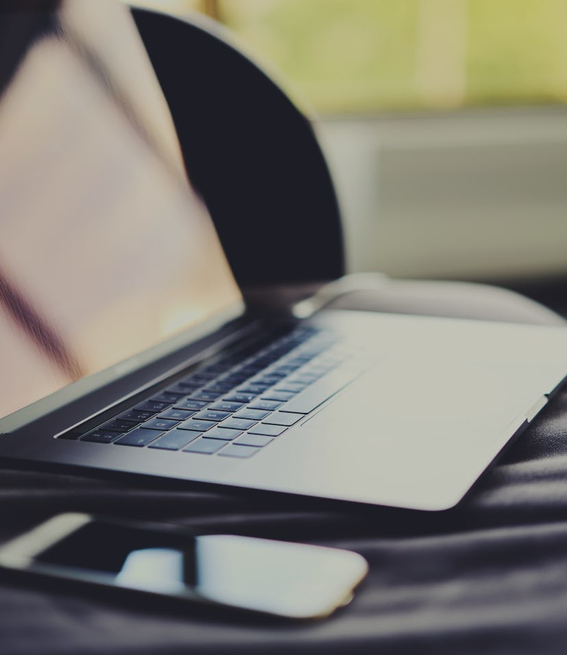 Beautiful space gray new model of stylish contemporary laptop with big trackpad. Modern portable com...