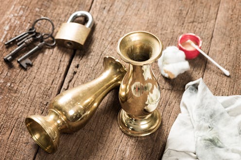 cleaning and polishing old brass jar
