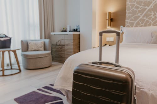  suitcases in light hotel room - Image