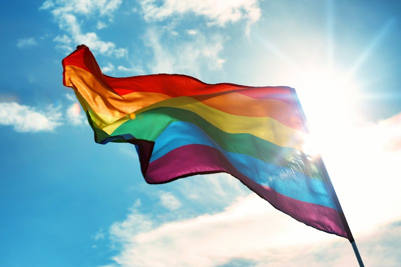 Gay flag on sky background