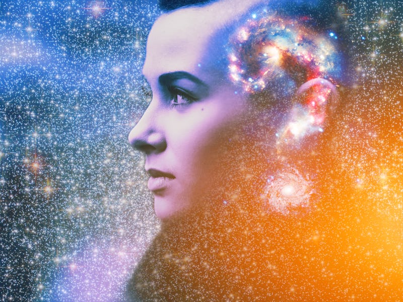 Double multiply exposure abstract portrait of young woman face with galaxy universe space inside hea...