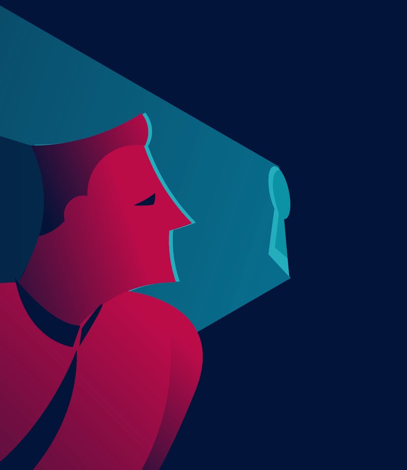 man looking into keyhole. non disclosure agreement, spying or information security concept in red an...