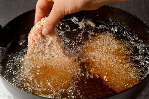 Homemade cooking of deep fried pork in pan