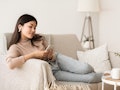 Time to Relax. Asian Girl in Airpods Listening Music Online on Smartphone, Copy Space