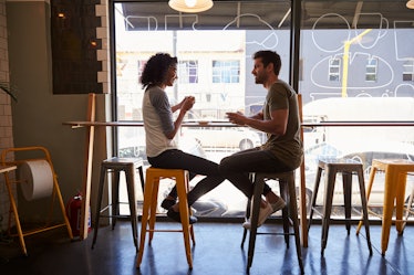 Couple Meeting For Date In Coffee Shop