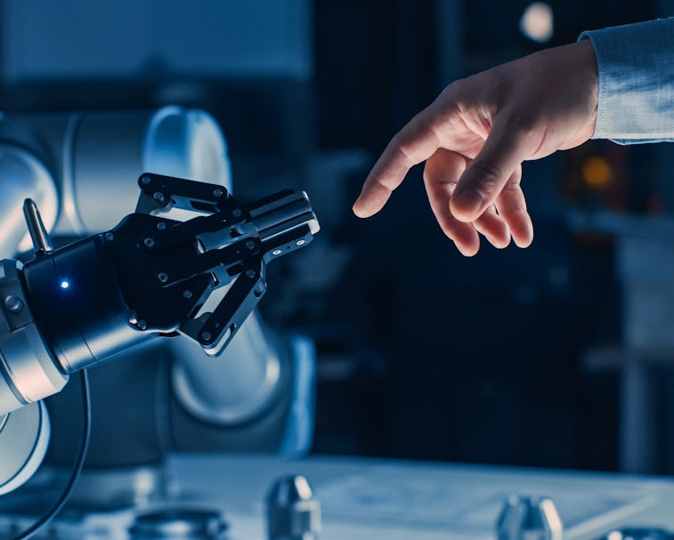 Futuristic Robot Arm Touches Human Hand in Humanity and Artificial Intelligence Unifying Gesture. Co...