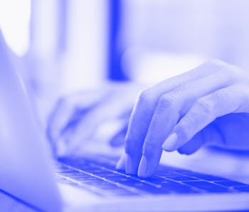 Closeup hand using computer laptop. Using online connect technology for business, education and comm...