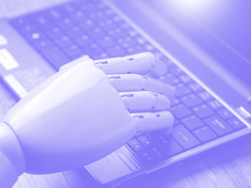 artificial intelligence hand type on keyboard