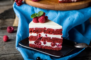 Red velvet cake on wood board. Slice of cake. Raspberry cake. Devil's cake. Wedding dessert. Birthda...