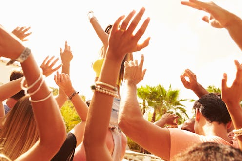 Group Of Young People Enjoying Outdoor Music Festival
