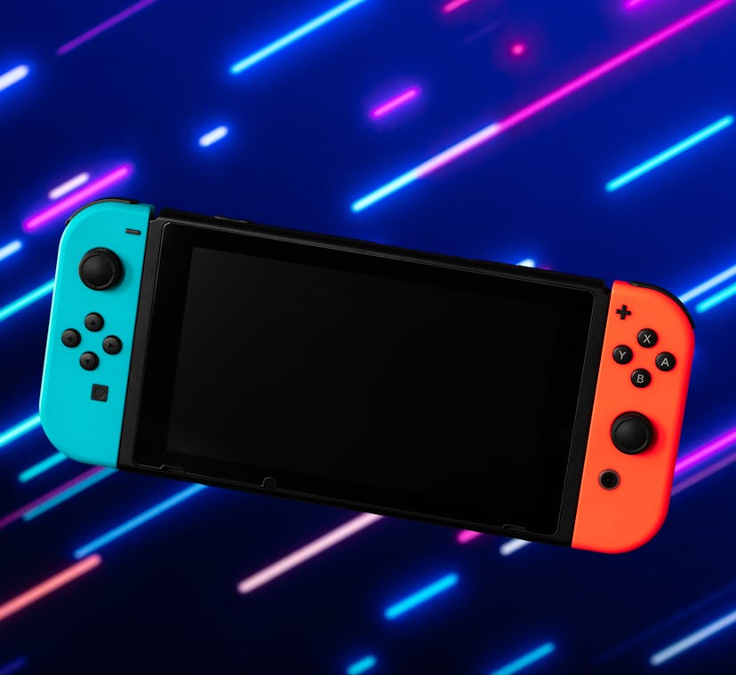 Photo of blue and orange video game console. Nintendo Switch. Android. How to hack Nintendo Switch. ...