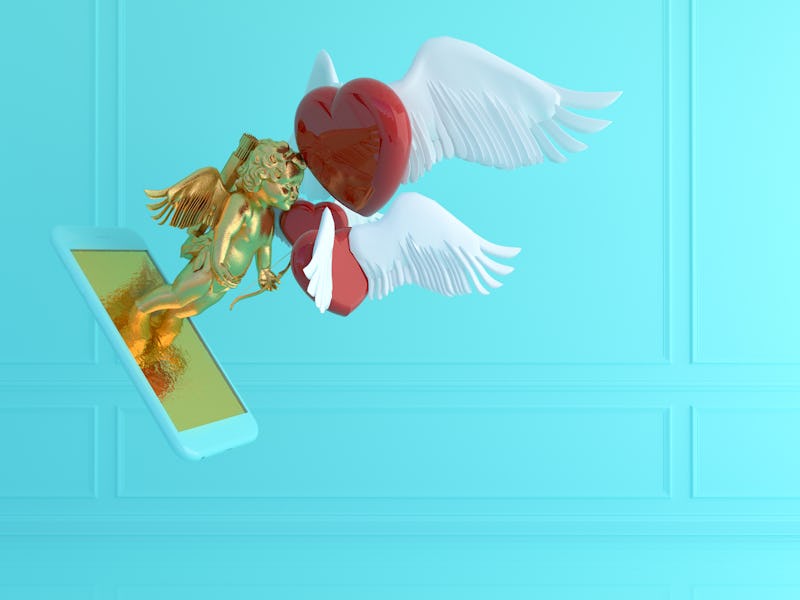 A golden Cupid emerges from the screen of a smartphone. There is a flying red heart with white wings...