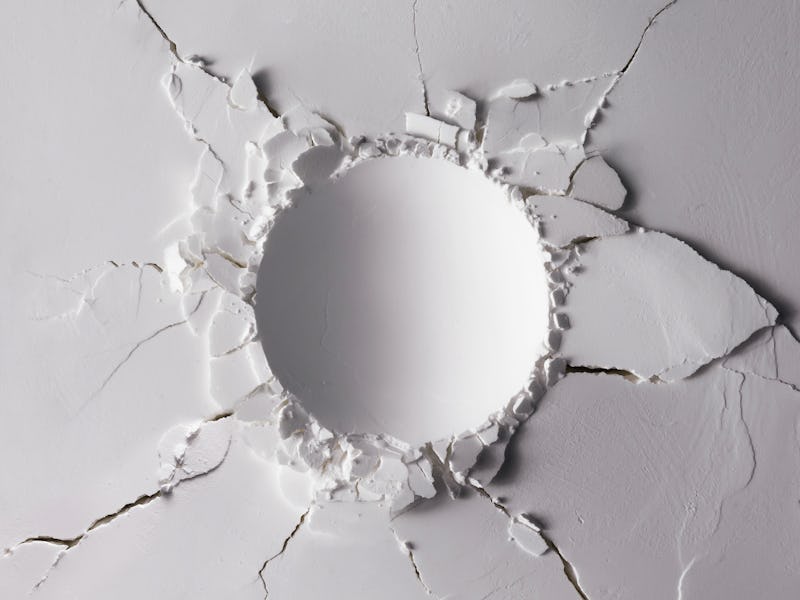 White powder texture with round impact crater. Minimalism flat lay.