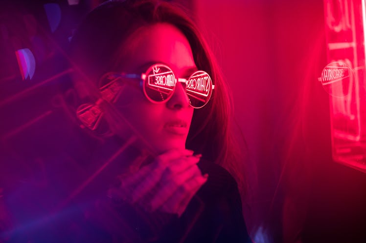 Cinematic night portrait of girl and neon lights