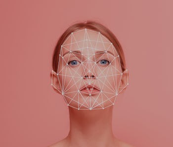 Facial recognition security system. Face augment mobile phone technology concept. Woman portrait loo...