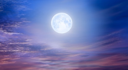 Night sky with moon in the clouds at sunset "Elements of this image furnished by NASA
