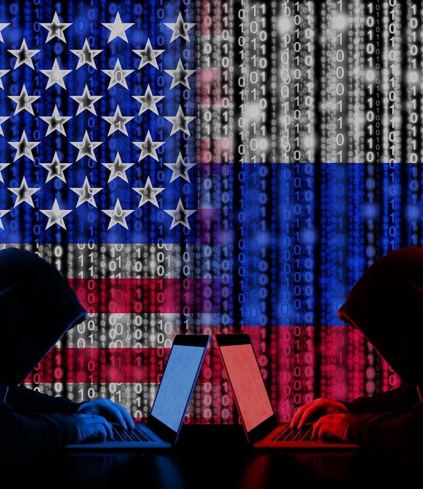 American hacker sitting opposite of a Russian hacker in a cyberwar concept photo. Both hackers are i...