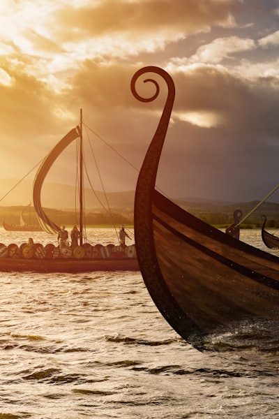Viking ships on the water under the sunlight and dark storm. Invasion in the storm. 3D illustration.