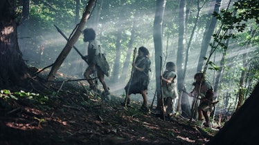 Tribe of Hunter-Gatherers Wearing Animal Skin Holding Stone Tipped Tools, Explore Prehistoric Forest...