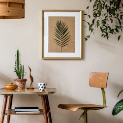 Retro interior design of living room with stylish vintage chair and table, plants, cacti, personal a...