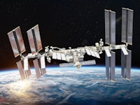 International space station on orbit of Earth planet. ISS. Dark background. Sun reflection. Elements...