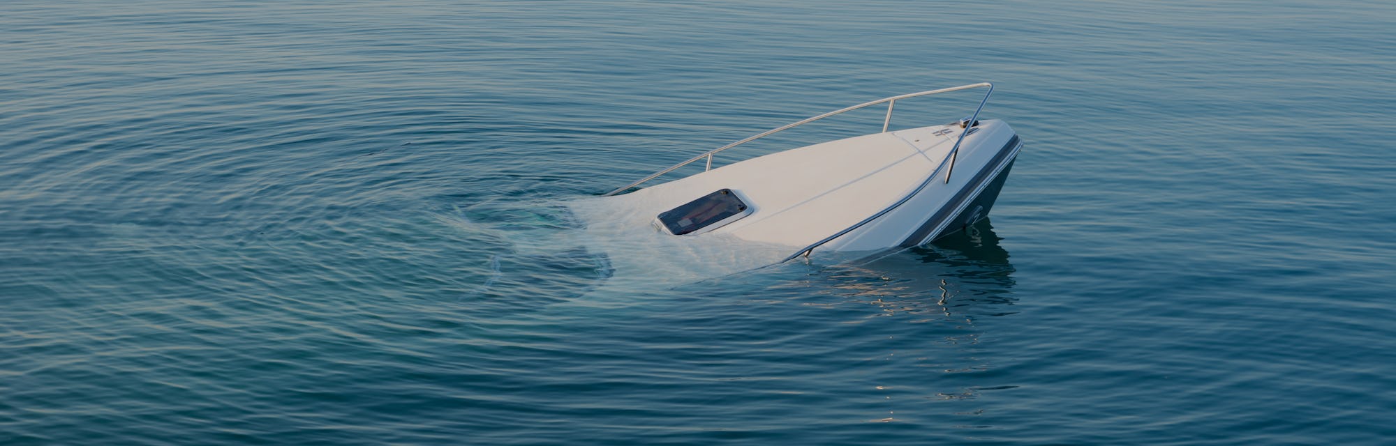 Sinking modern large white boat goes underwater