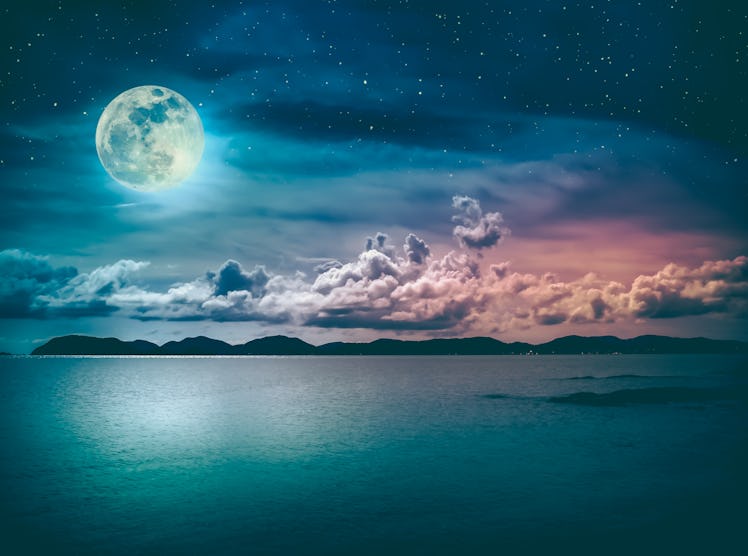 Beautiful landscape view of the sea with many stars . Attractive sky and  full moon on seascape to n...