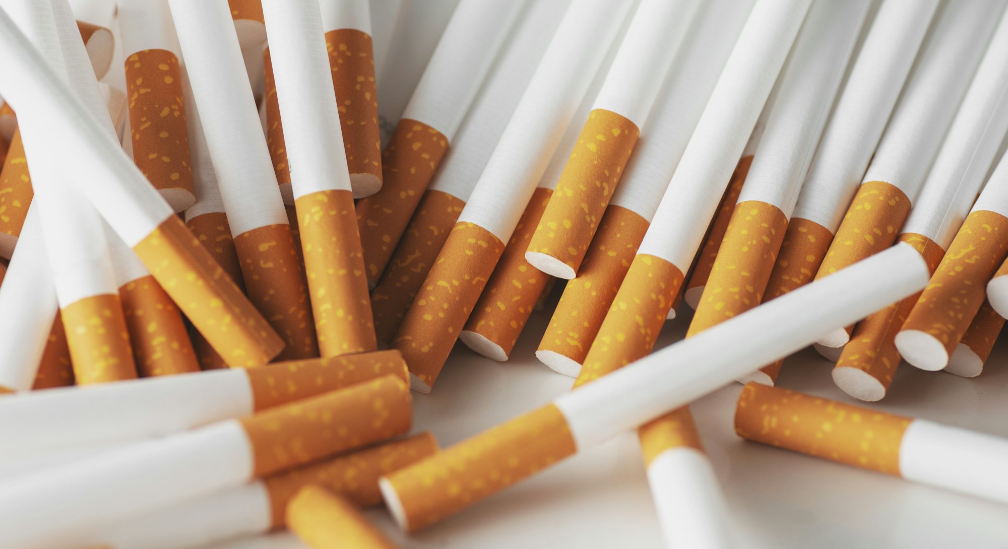 Close up of a smoking cigarettes . cigarette filter tubes
