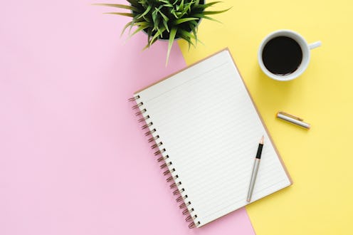Creative flat lay photo of workspace desk. Top view office desk with mock up notebooks, plant, coffe...