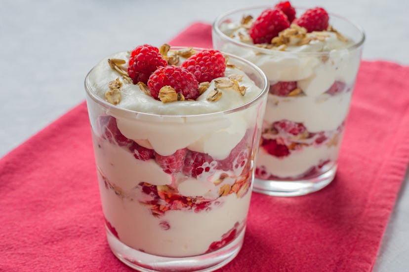 Cranachan - Traditional Scottish dessert with raspberry, whipped cream, roasted oatmeal and whisky o...