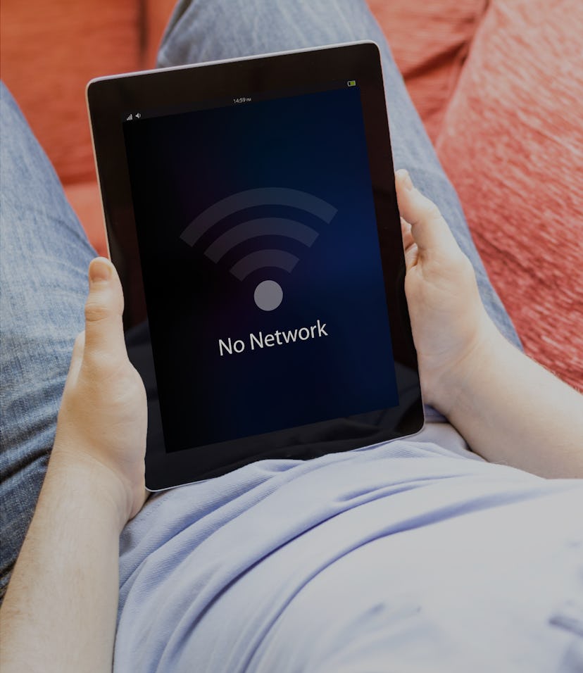 man relaxing at sofa with no network tablet pc