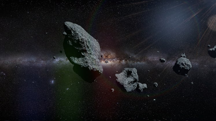 a group of asteroids in front of the Milky Way galaxy (3d illustration, elements of this image are f...