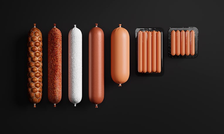Smoked sausage stick, dry salami sausage, doctor sausage, plastic tray of fresh raw sausages isolate...
