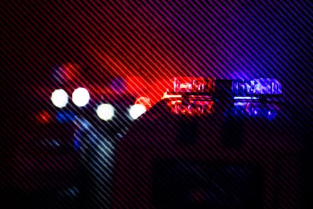 Police cars at night. Police car chasing a car at night with fog background. 911 Emergency response ...