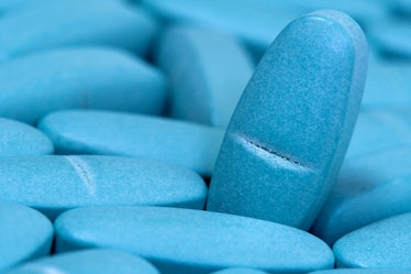 Medical blue pills macro background. Medicine concept of viagra, medication for stomach, erection, s...