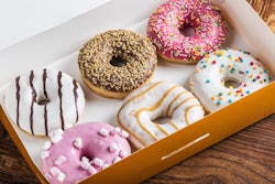 glazed donuts with different fillings in the box