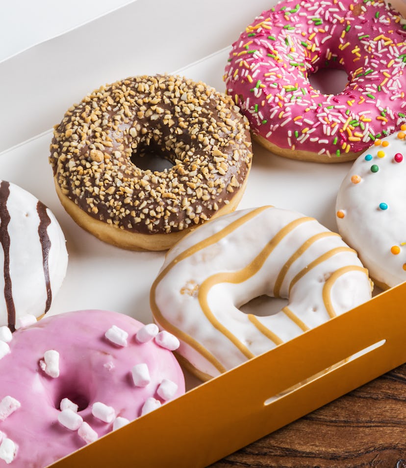 glazed donuts with different fillings in the box