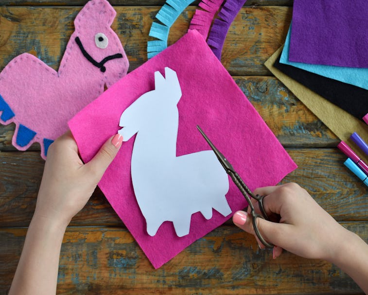 Making pink lama. Sewing toys from felt with your own hands. DIY concept for children. Handmade craf...